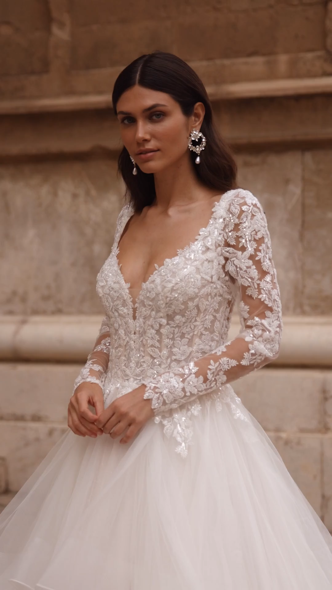 Bride In Moonlight Couture Style H1565 an A-line With Cascades and Long Sleeves