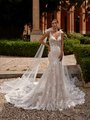 Bride In Drop Waist Mermaid Wedding Dress With Detachable Tulle Bow Tails On Shoulder
