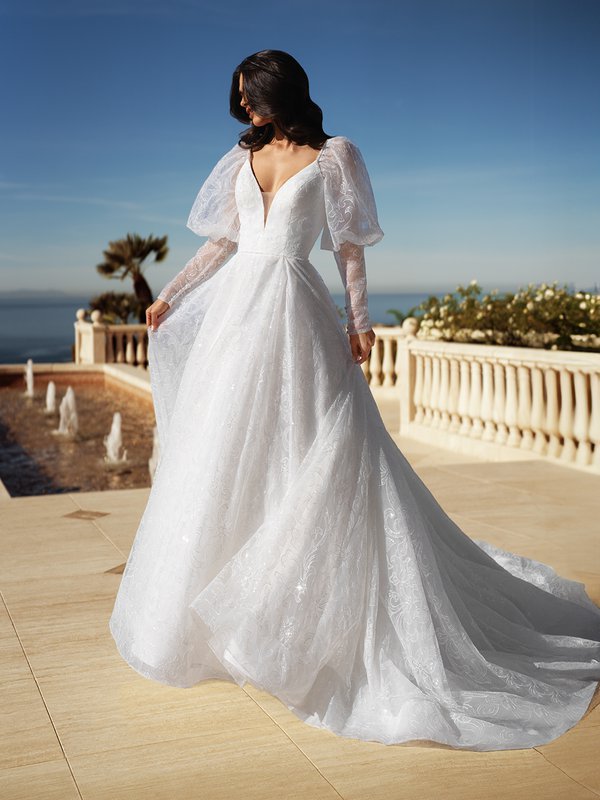 Front View Of Bride Wearing Moonlight Couture H1582 Embroidered Tulle with Sequins A-Line Gown With Juliet Long Sleeves