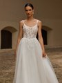 Illusion scoop neckline wedding dress with corset boning and vine lace details along the bodice