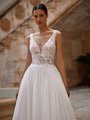 V-neckline with large floral applique wedding dress with inset waistline and thick straps