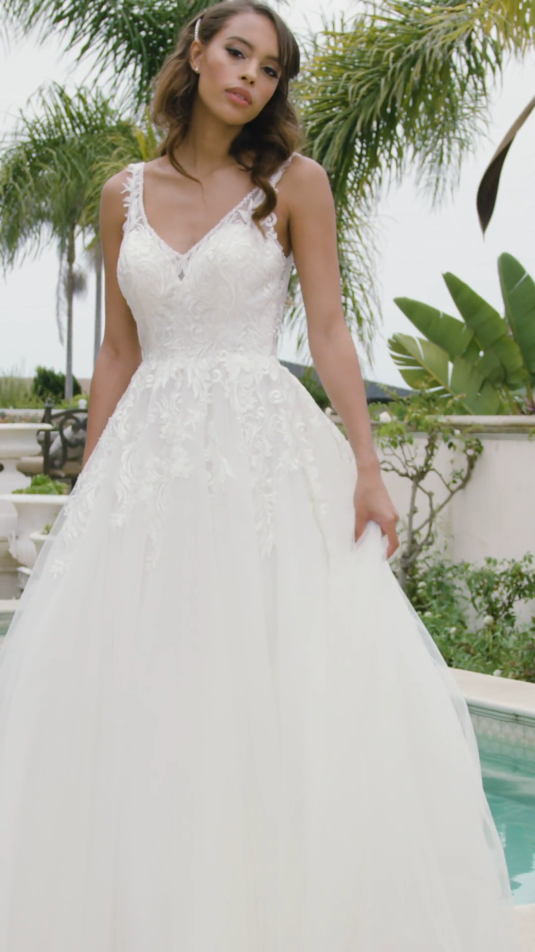 Moonlight Tango T930 V-neck A-line wedding dress with lace bodice and beaded trim necklines and buttons along illusion back