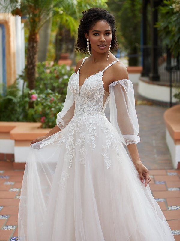 A-line wedding dress with a deep V-neckline lace bodice and tulle skirt